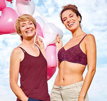 Amoena Shop Valletta Top und Mara SB HW2022 Zwei Frauen mit Luftballons Valetta Top und Prothesen-BH Mara